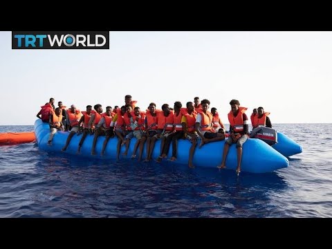 Refugee Crisis: Rescued passengers disembark on Lampedusa